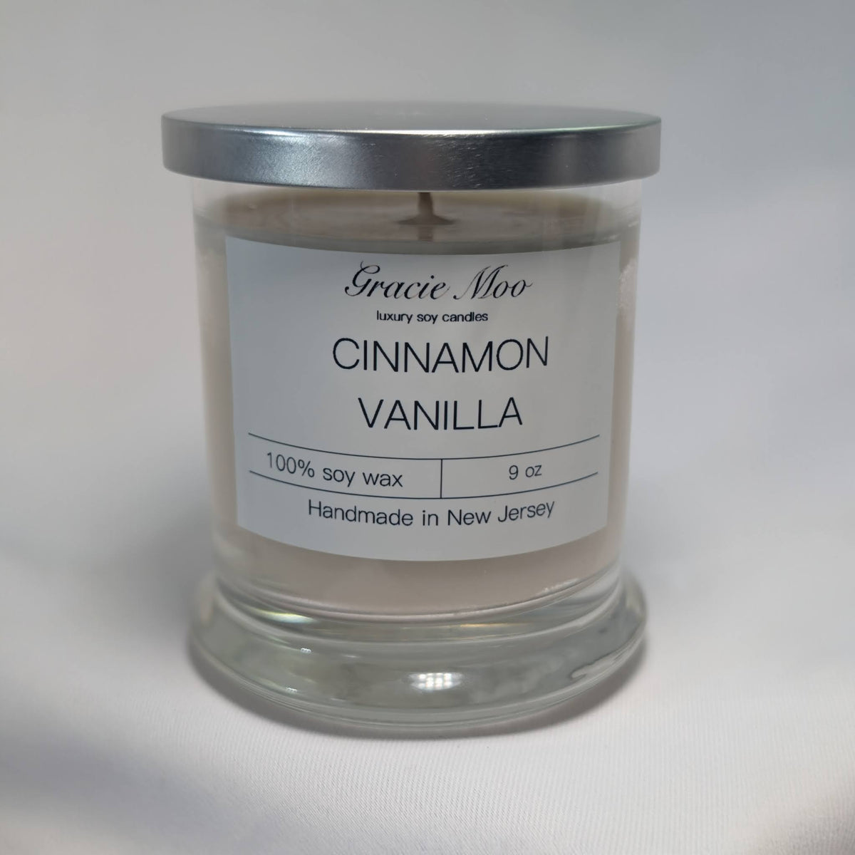 Cinnamon Vanilla Status Candle by Gracie Moo Candles, showcasing a warm, inviting candle with cinnamon and vanilla scent notes.