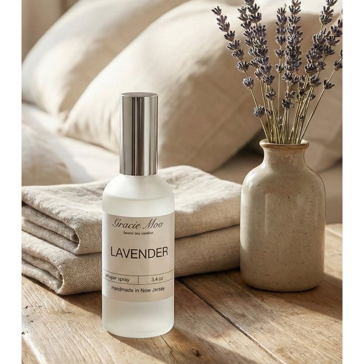 GracieMoo Candles Whisper Spray room body spray with elegant bottle and mist spray nozzle in a close-up shot