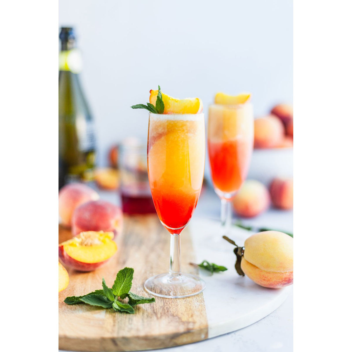 GracieMoo Candles Whisper Spray room body spray featuring a frozen peach bellini scent in a sleek bottle.