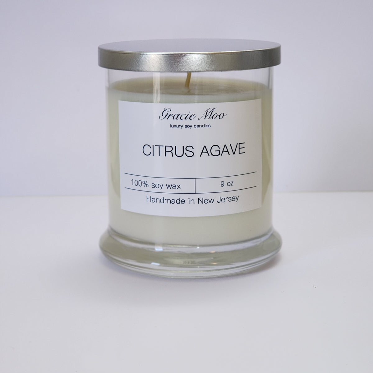 Citrus Agave Status candle by Gracie Moo Candles, showcasing a beautifully designed candle in a glass jar with fresh citrus and agave scent.