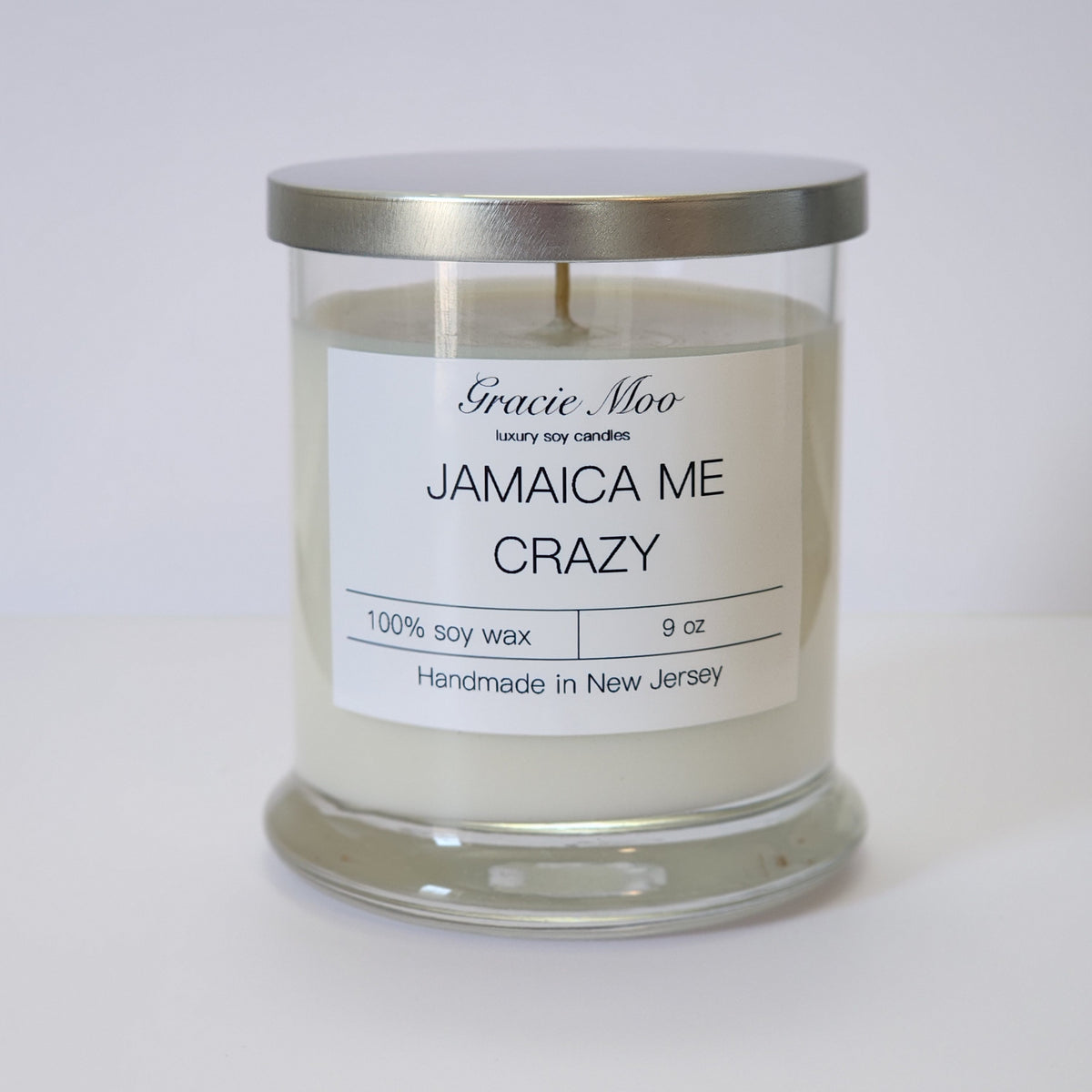 Gracie Moo Candles Jamaica Me Crazy Status Candle with tropical-themed design and vibrant colors.