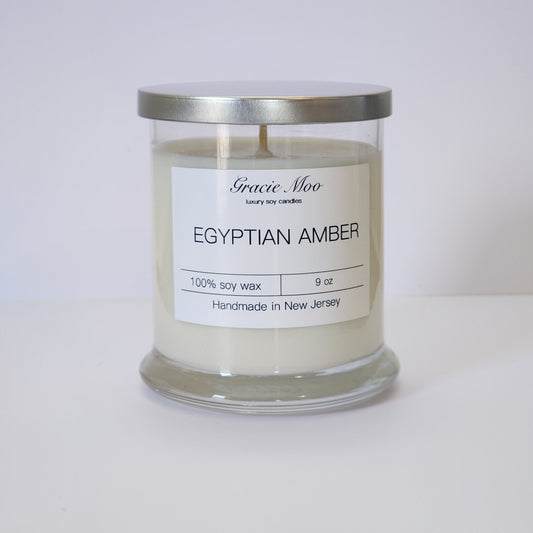 Egyptian Amber Status Candle by Gracie Moo Candles, decorative candle with warm amber-colored wax and elegant design.