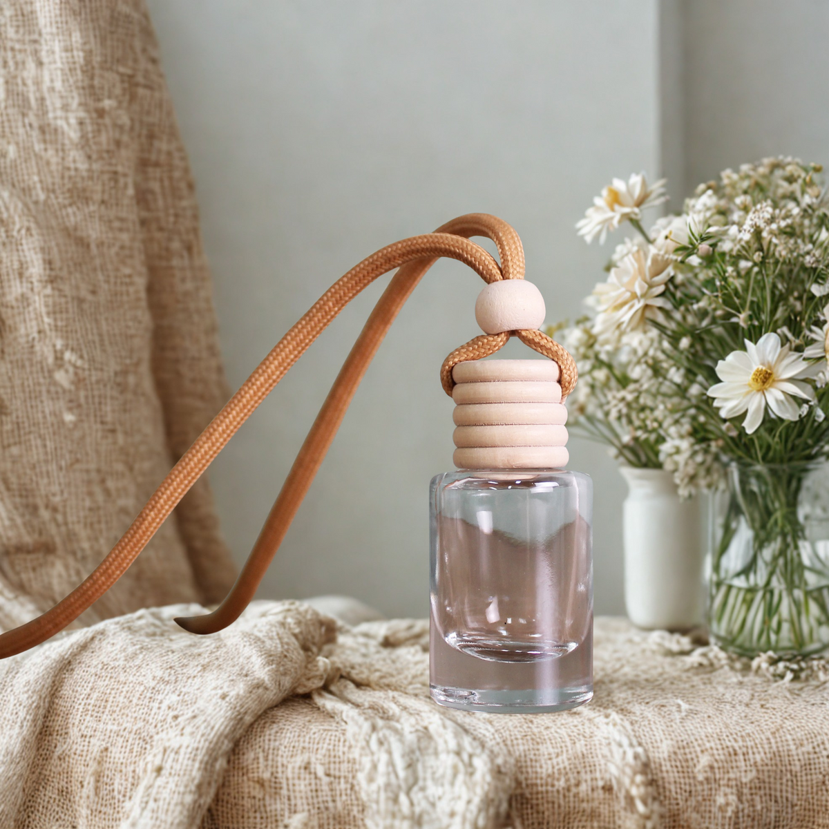 Hanging Gracie Moo Candles diffuser atomizer with glass container and hanging string, designed for aromatic oil diffusion.