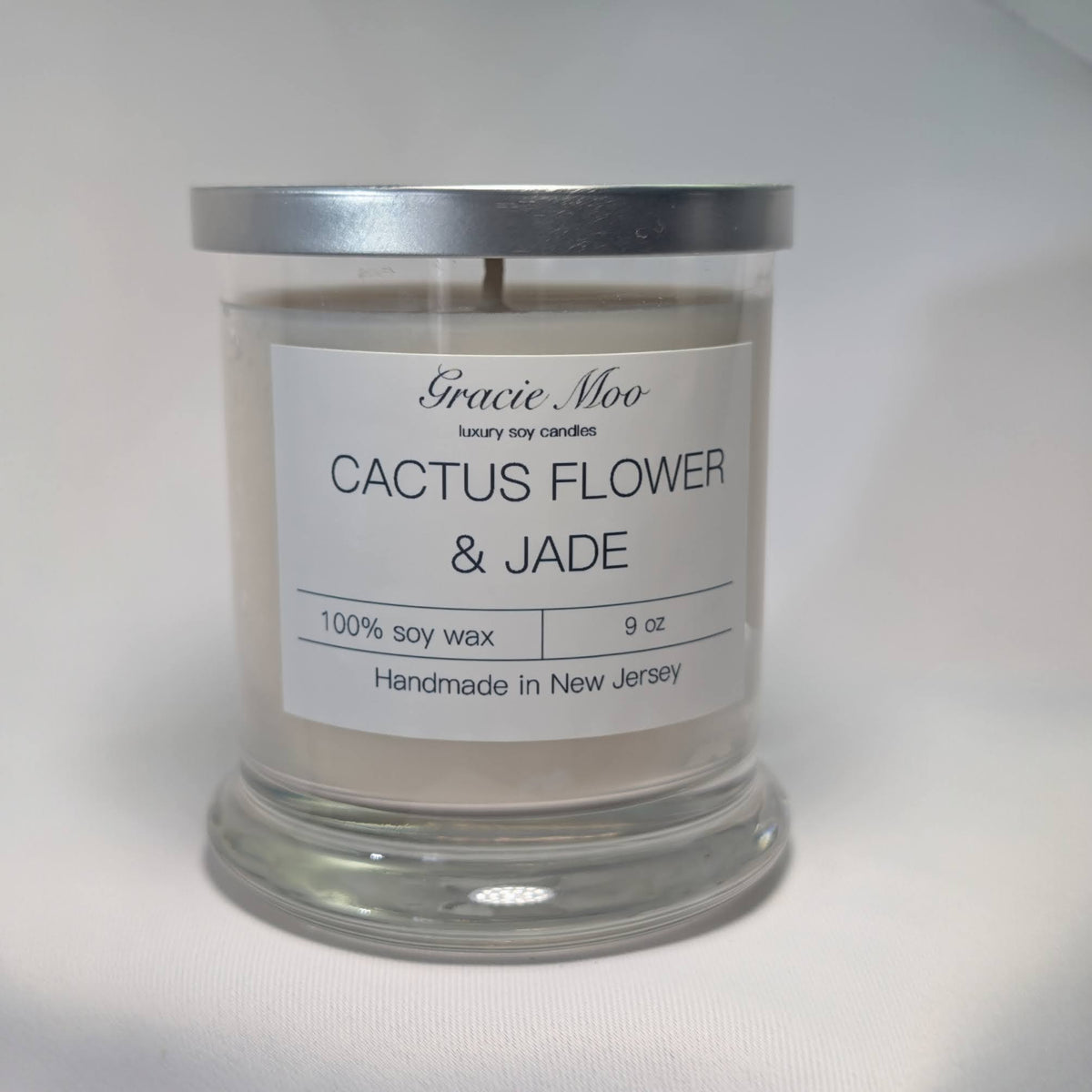 Cactus Flower and Jade Status Candle by Gracie Moo Candles featuring a decorative candle with cactus flower and jade accents.