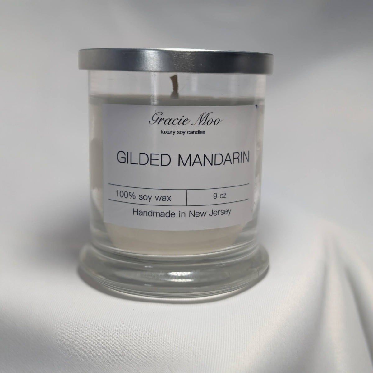 Gilded Mandarin Status Candle by Gracie Moo Candles, featuring a luxurious gold finish and elegant design.