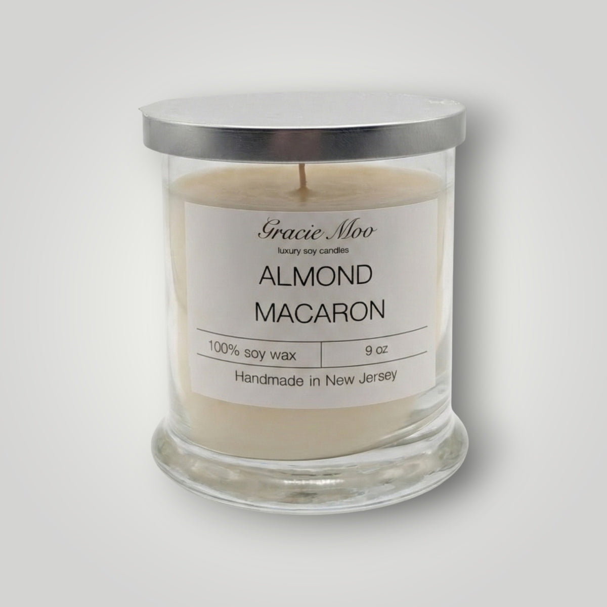 Almond Macaron Status Candle by Gracie Moo Candles, featuring a delicate almond macaron design and soft pastel colors.