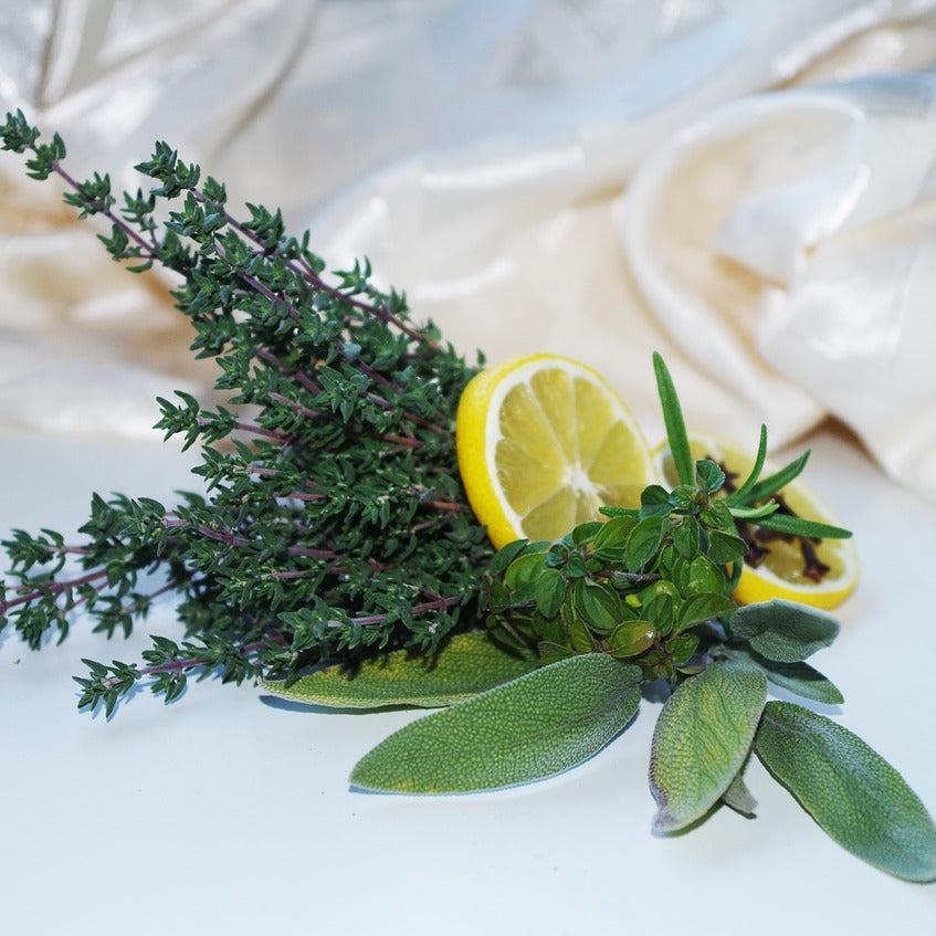 Gracie Moo Candles Rosemary Sage Status Candle with a simple glass holder and natural herbal scent.